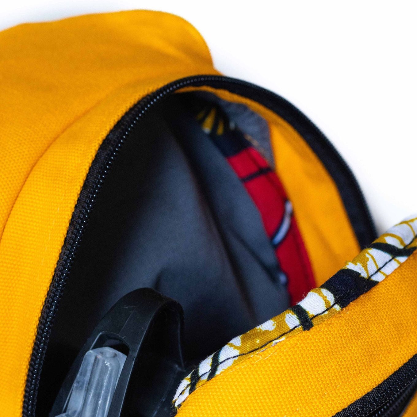 Umoja orange artisan canvas sling bag detail