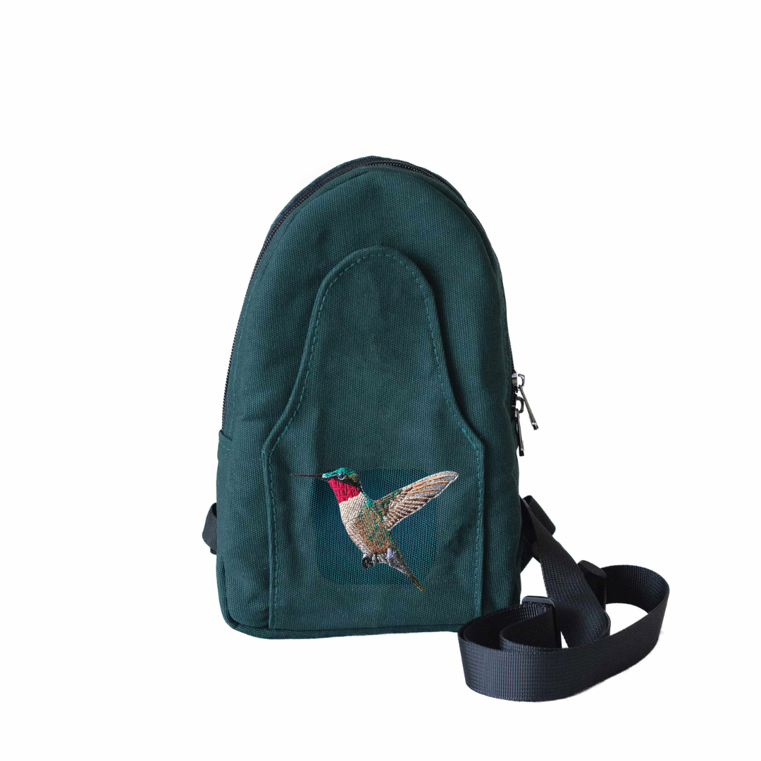 Buru hummingbird embroidered canvas sling bag flat lay