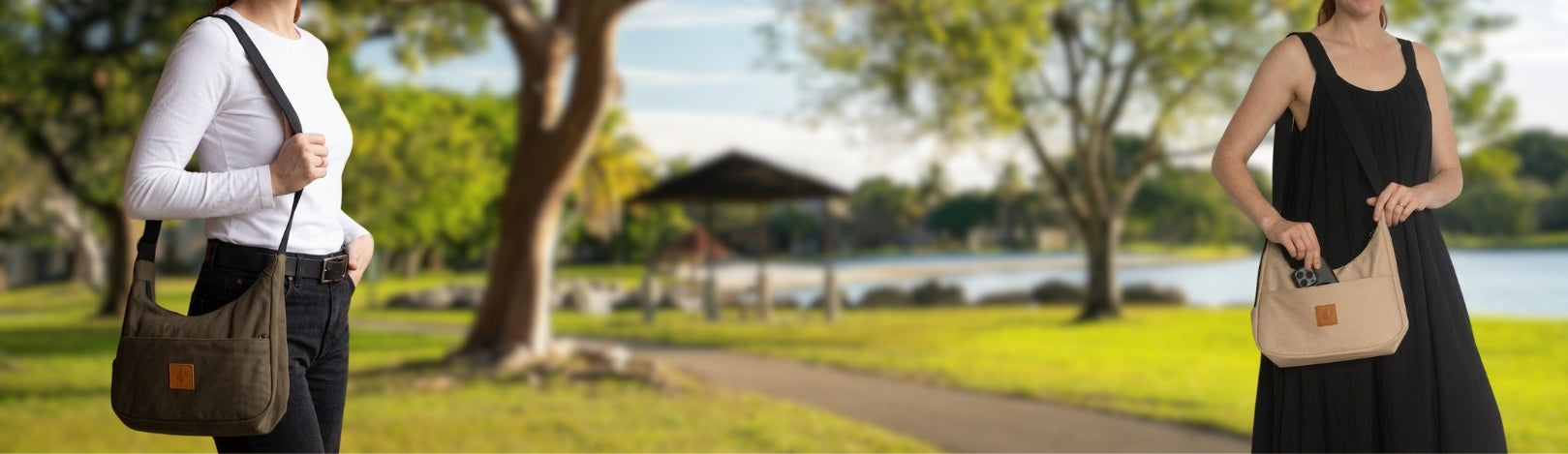 Two women walking with Crescent Shoulder bag in a park setting