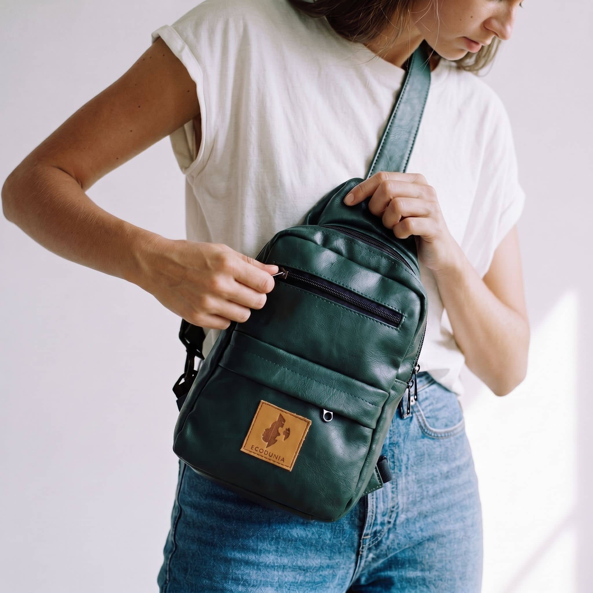 Umoja forest green vegan leather sling bag #color_forest-green