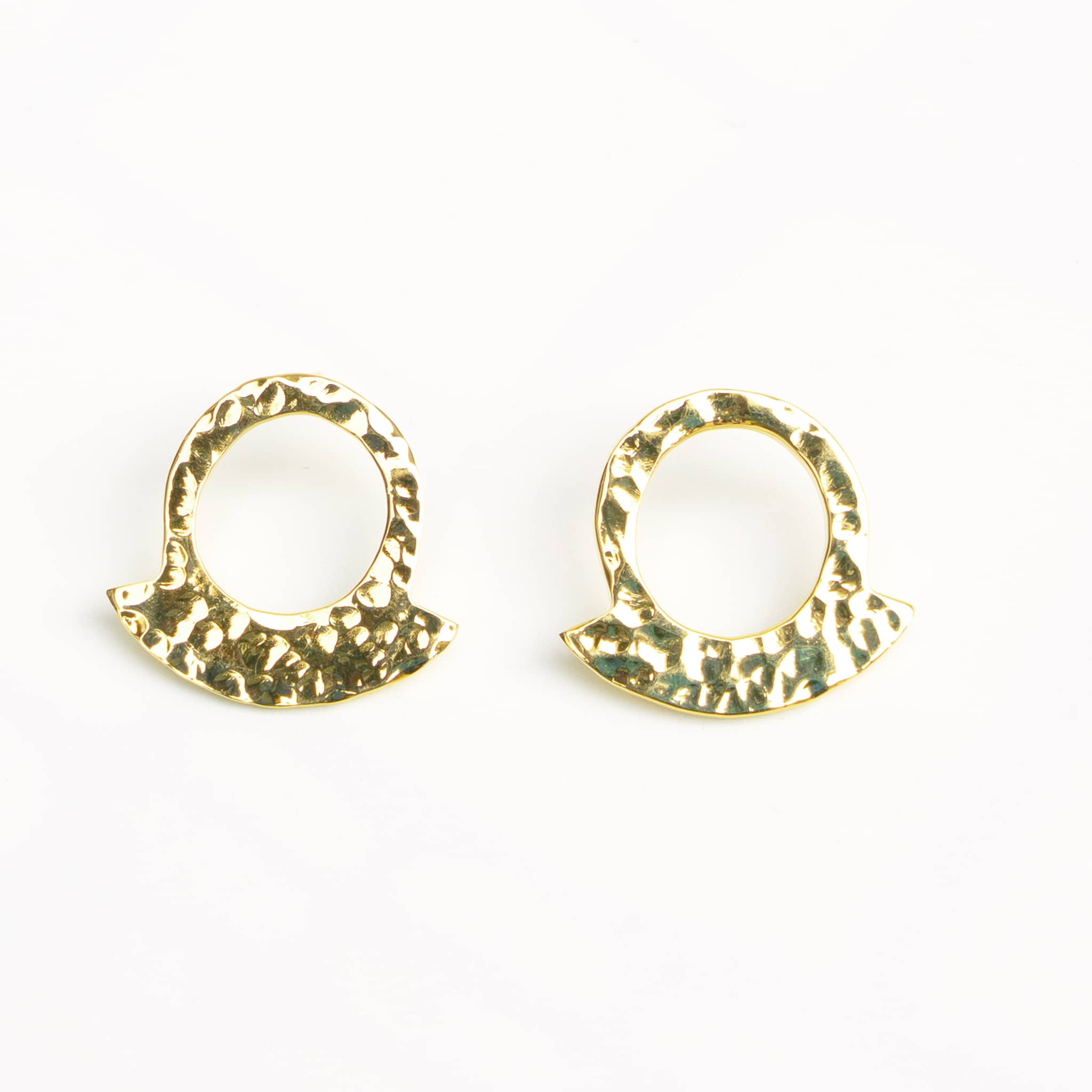 Leo hammered crescent hoop earrings worn showing arc shape