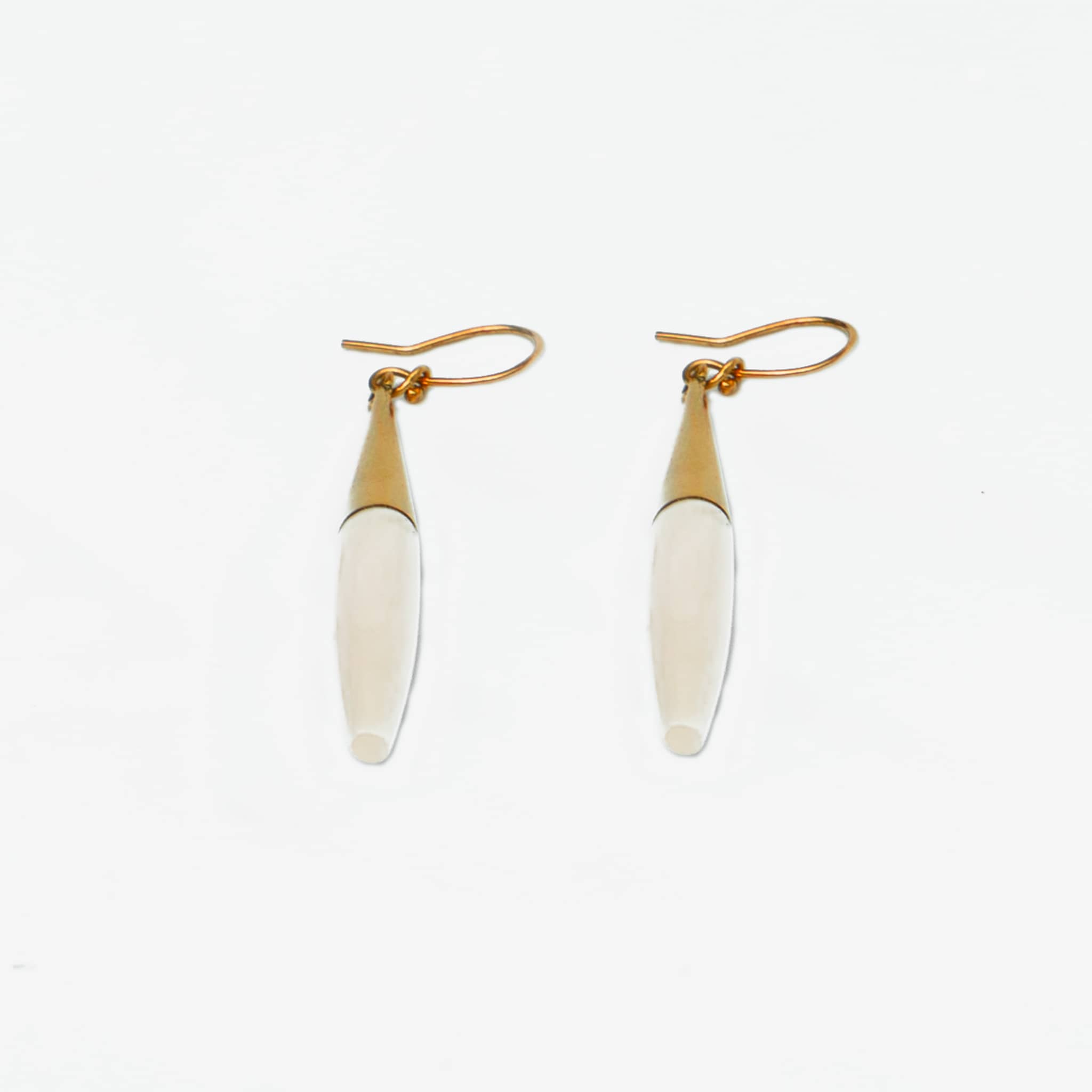 Luna brass and white horn spike drop earrings flat lay — Ecodunia