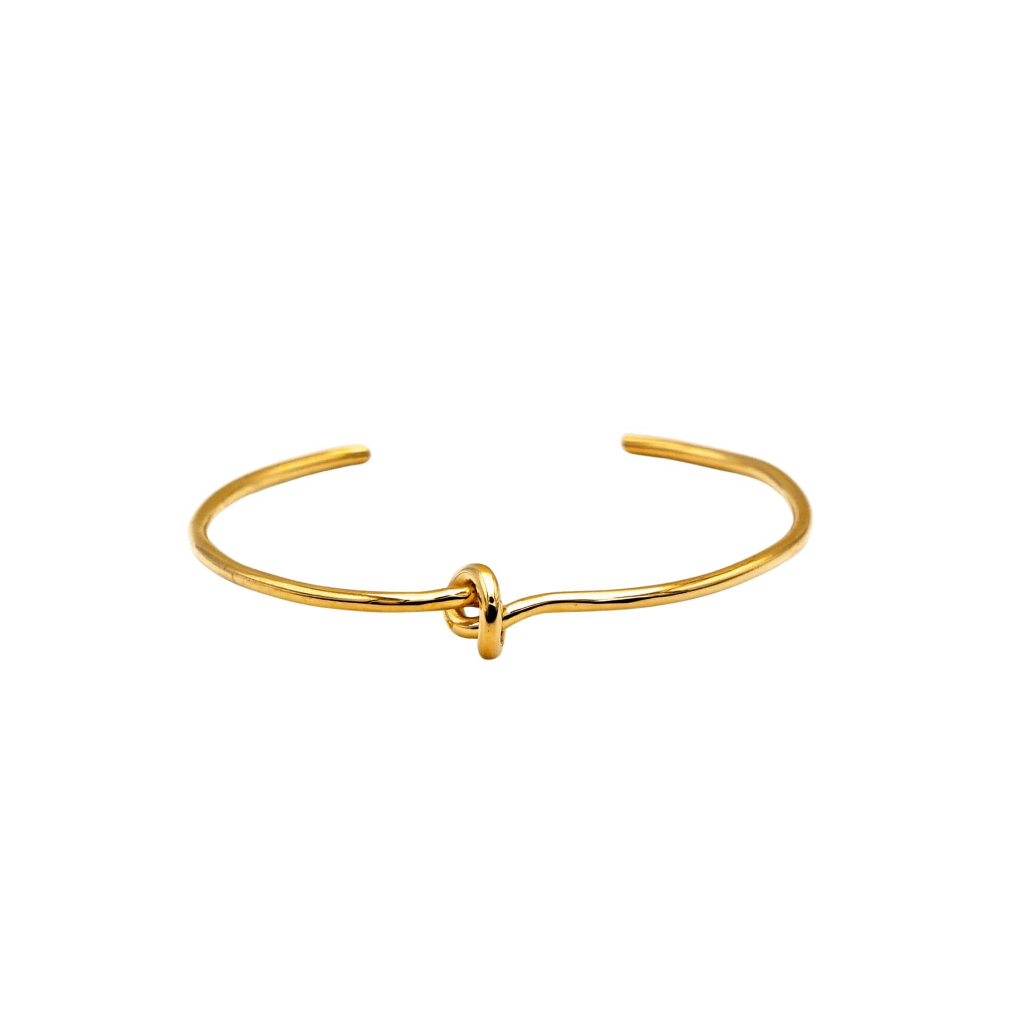 Tatu knot brass choker necklace worn on neck showing center knot detail