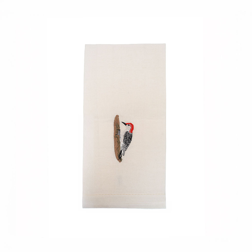 Woodpecker bird embroidered cotton tea towel flat lay on white surface