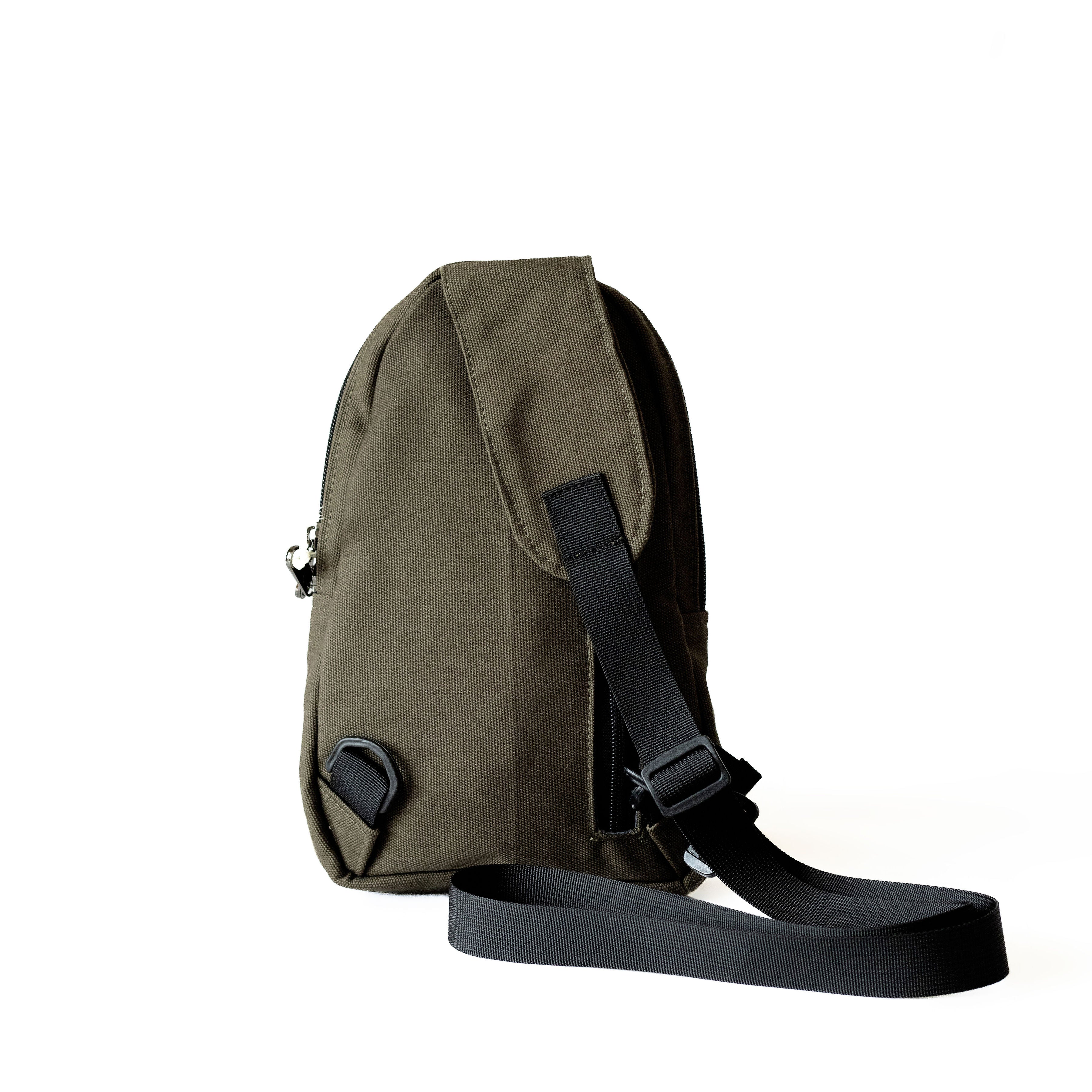 Buru green canvas sling bag worn crossbody