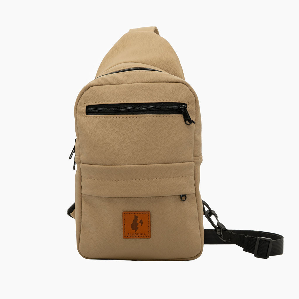 Umoja latte vegan leather sling bag flat lay