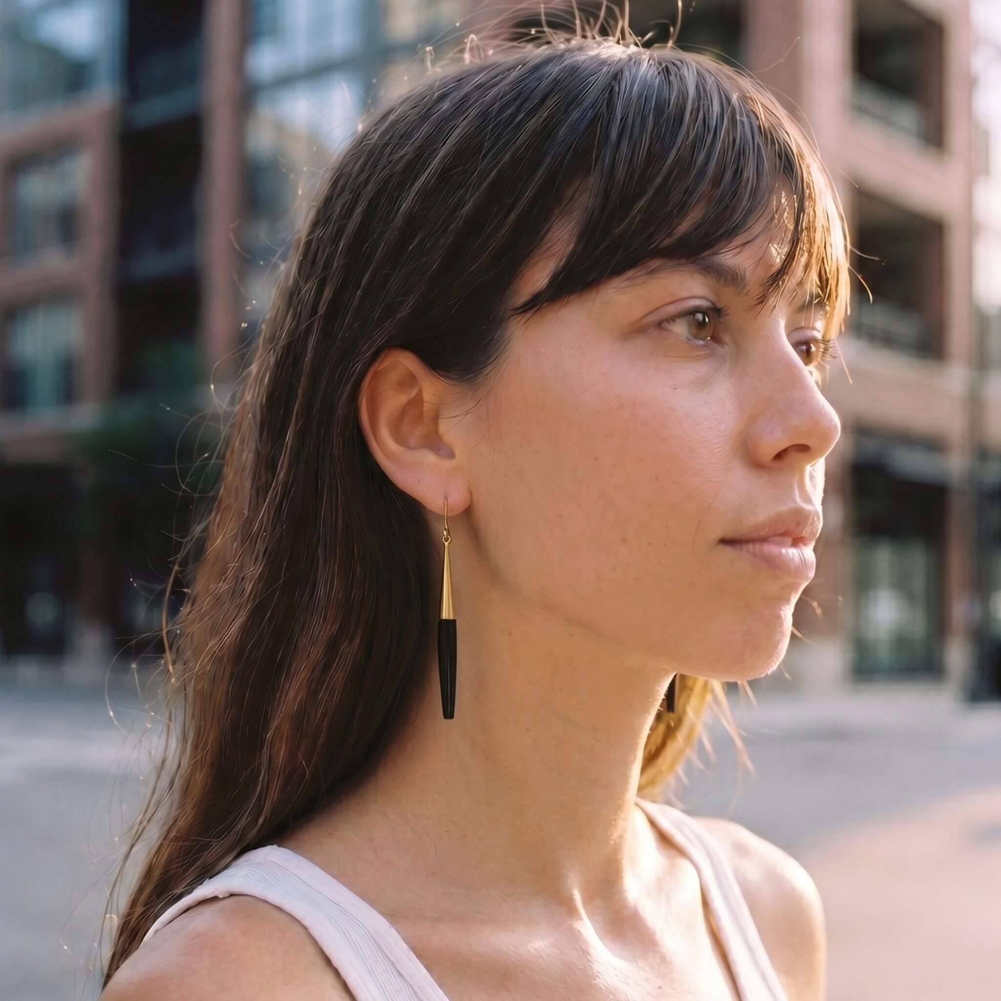 Luna brass and white horn spike drop earrings flat lay — Ecodunia 