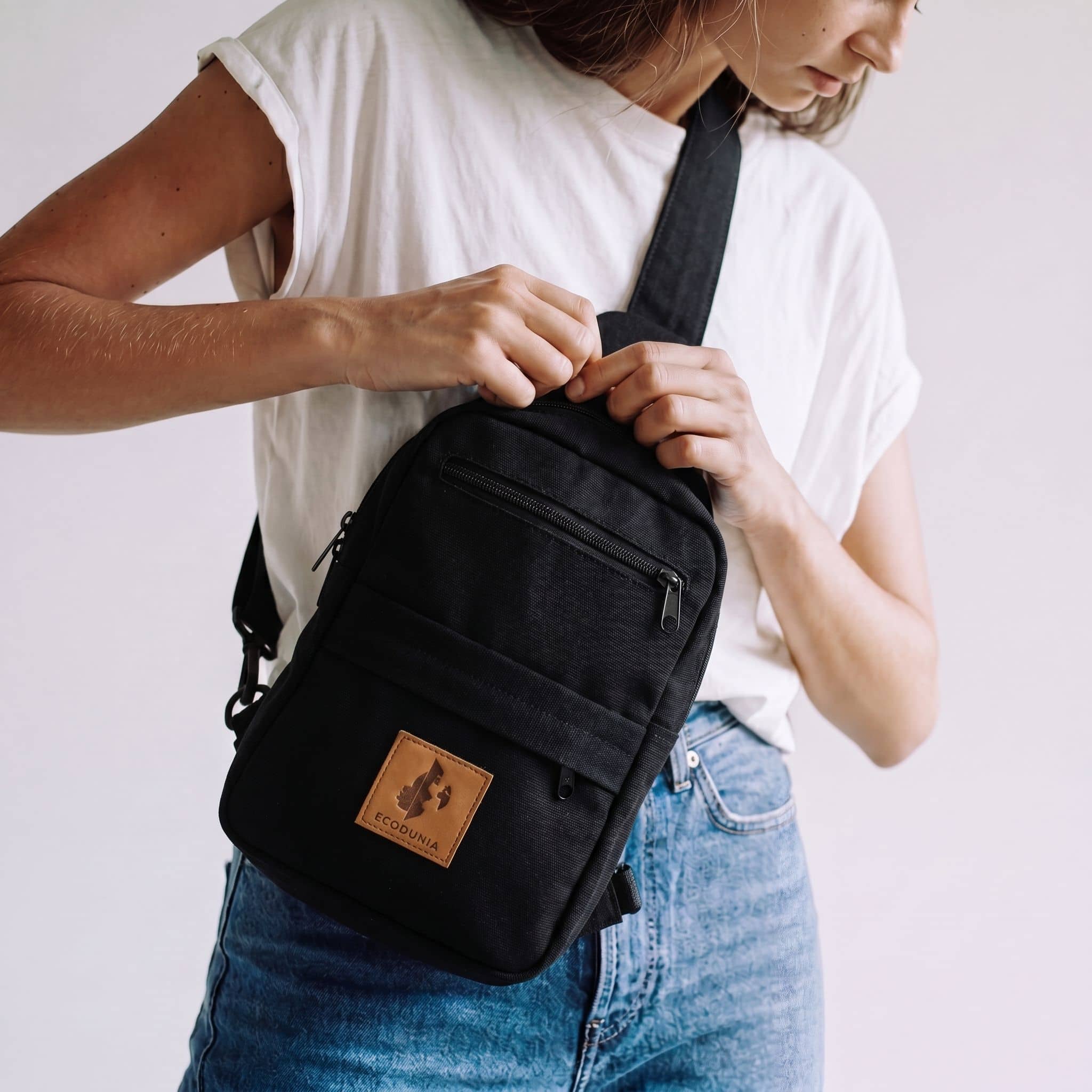 Umoja black canvas crossbody sling bag for men and women 