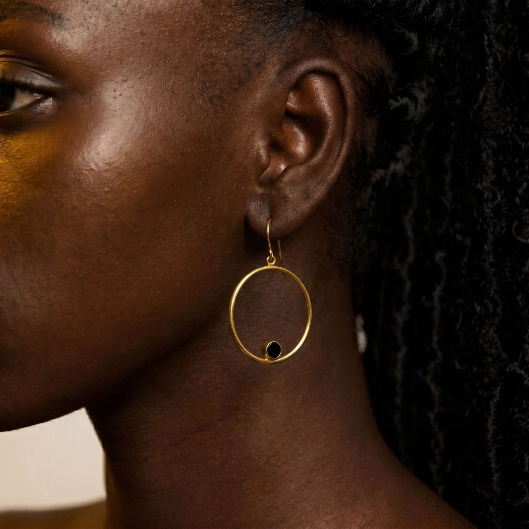 Lozi brass hoop with black horn accent earrings flat lay — Ecodunia 
