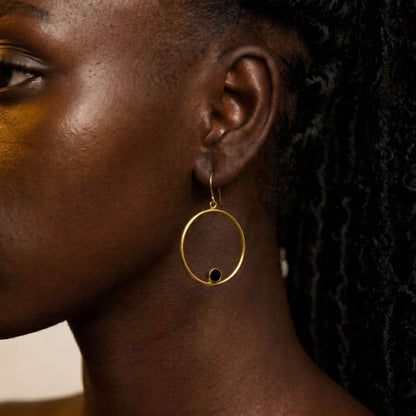 Lozi brass hoop with black horn accent earrings flat lay — Ecodunia 