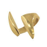 Close-up of Umbo brass ring showing paired petal forms on open cuff band