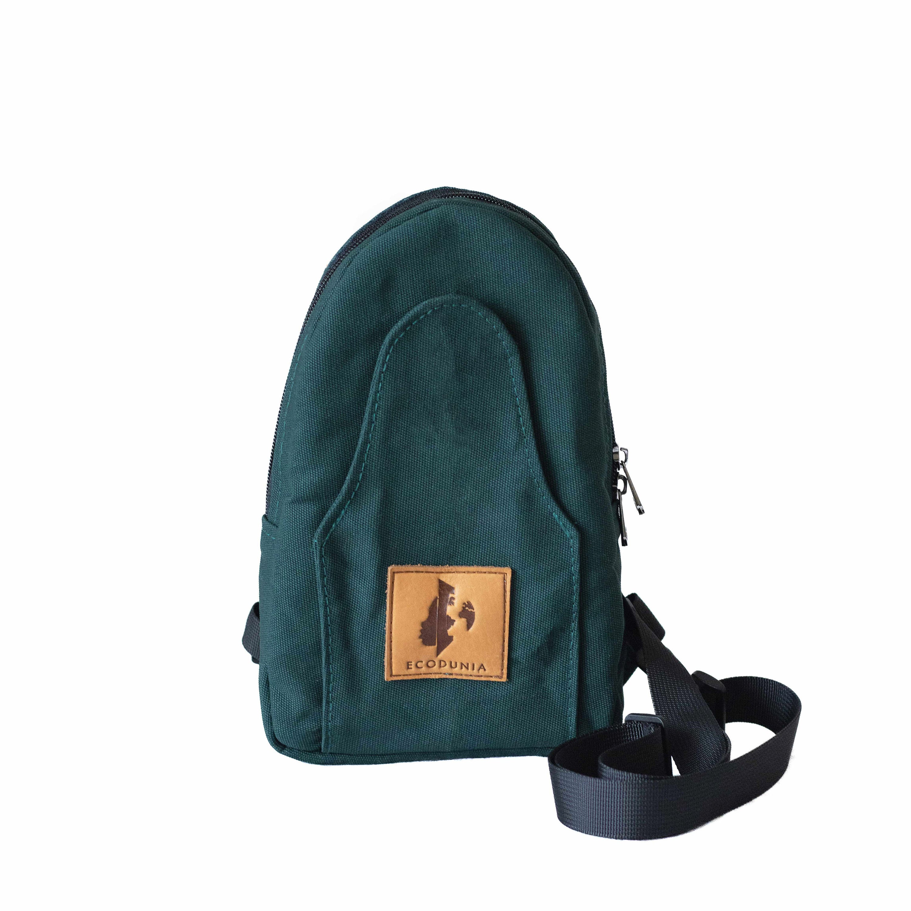 Buru canvas sling bag in forest green worn crossbody 