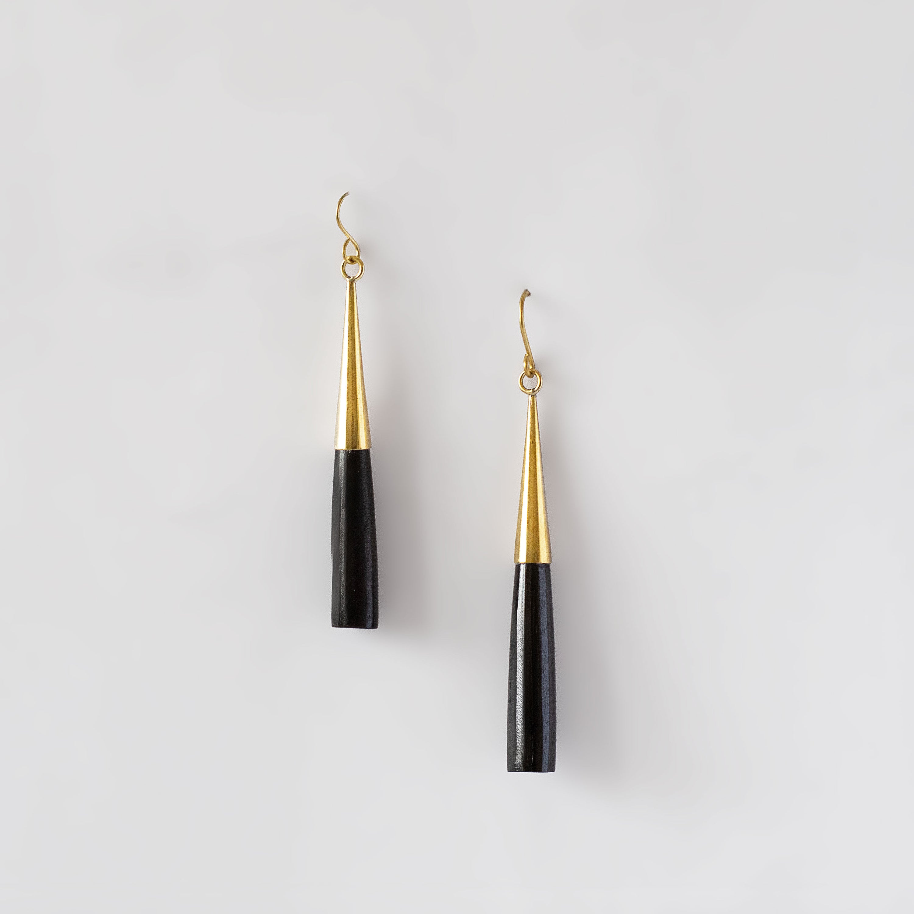 Lulu brass and black horn drop earrings flat lay — Ecodunia 