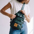 Umoja forest green vegan leather sling bag 