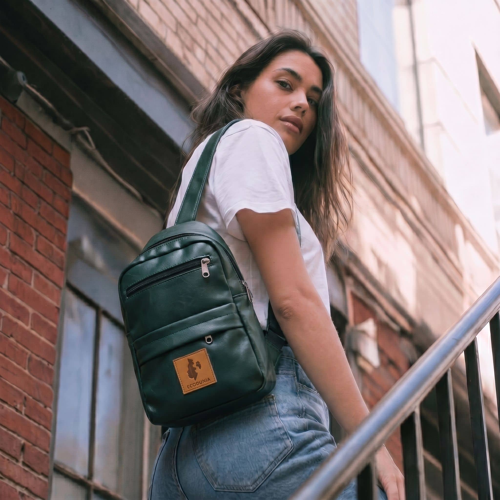 Umoja forest green vegan leather sling bag 