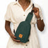 Buru canvas sling bag in forest green worn crossbody 
