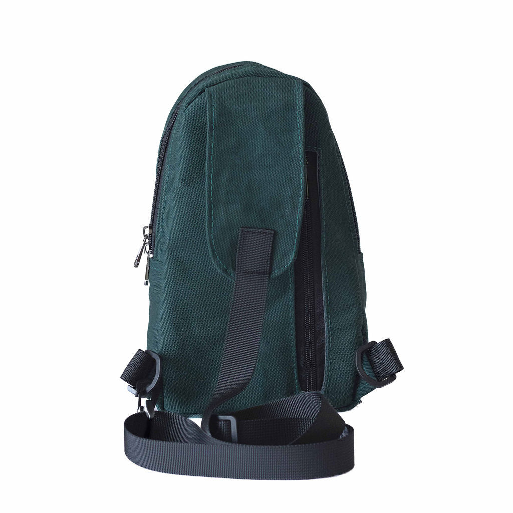 Buru canvas sling bag in forest green worn crossbody 
