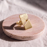 Kiu hammered brass rectangular ring flat lay — Ecodunia