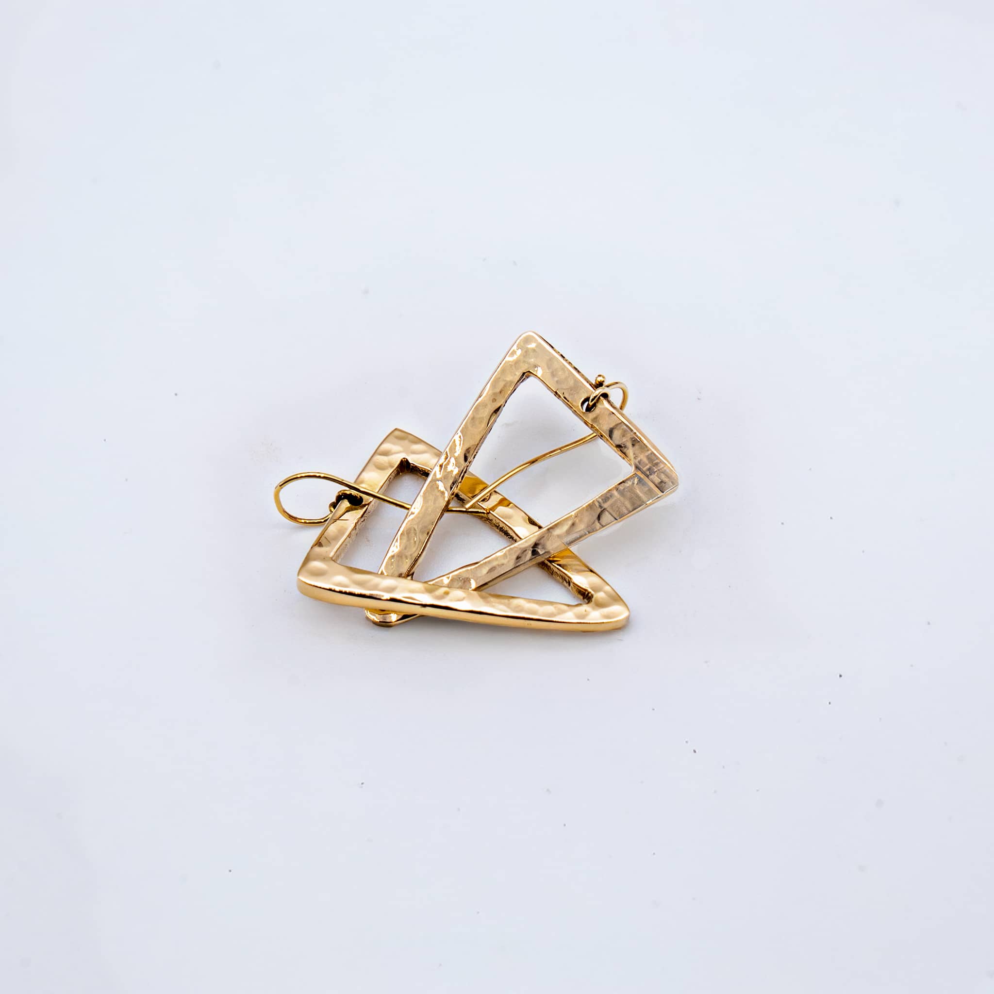 Lani hammered triangle hoop earrings pair showing hollow form