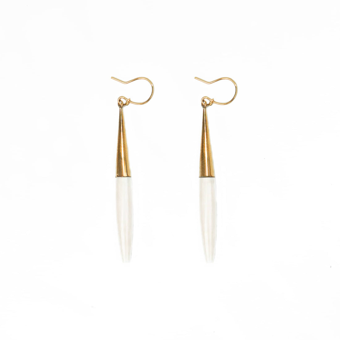 Luna brass and white horn spike drop earrings flat lay — Ecodunia 