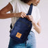 Umoja navy blue canvas sling bag flat lay 
