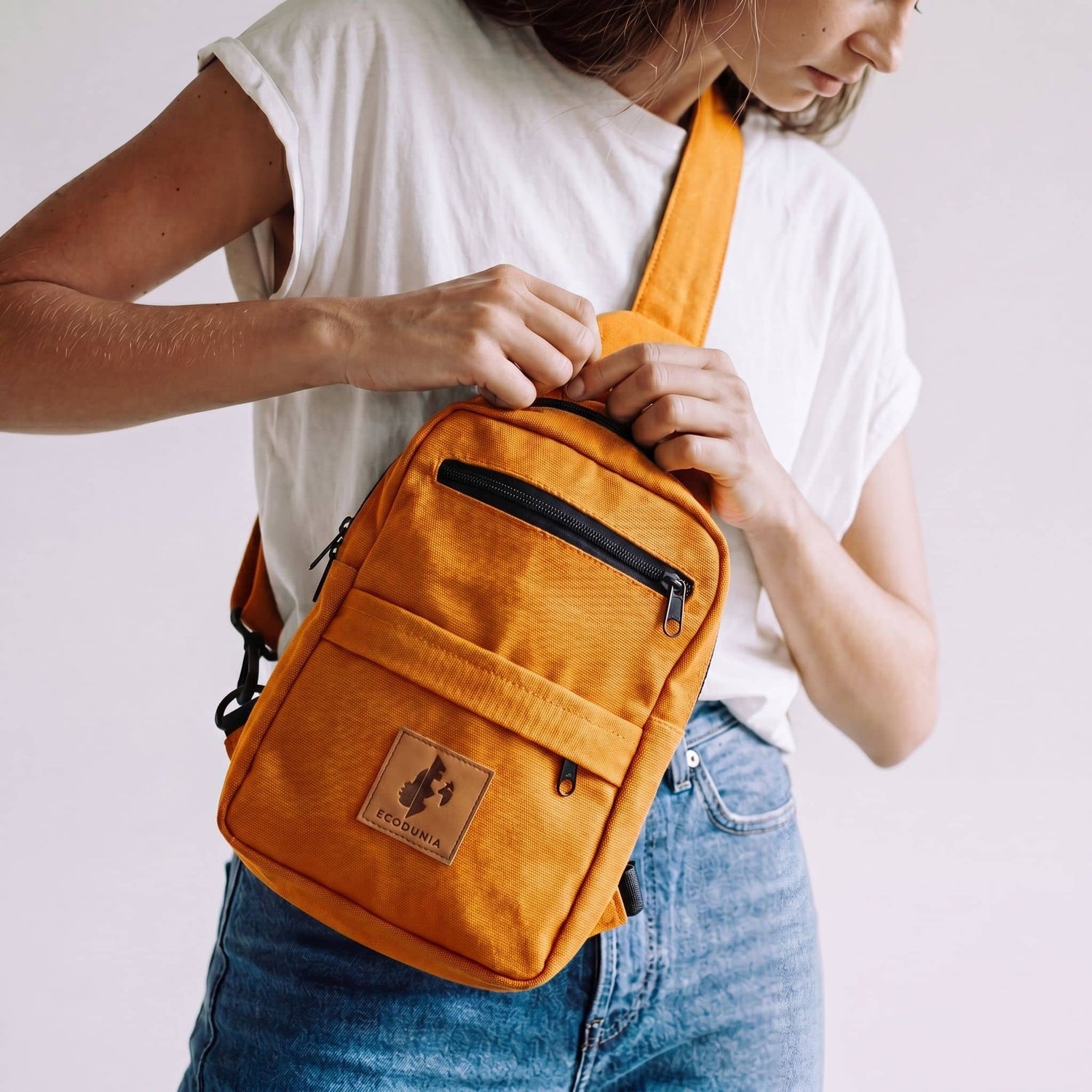 Umoja orange canvas crossbody sling bag 