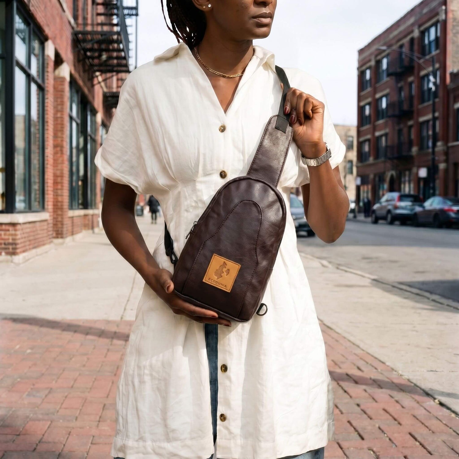 Buru plum vegan leather sling bag worn crossbody 