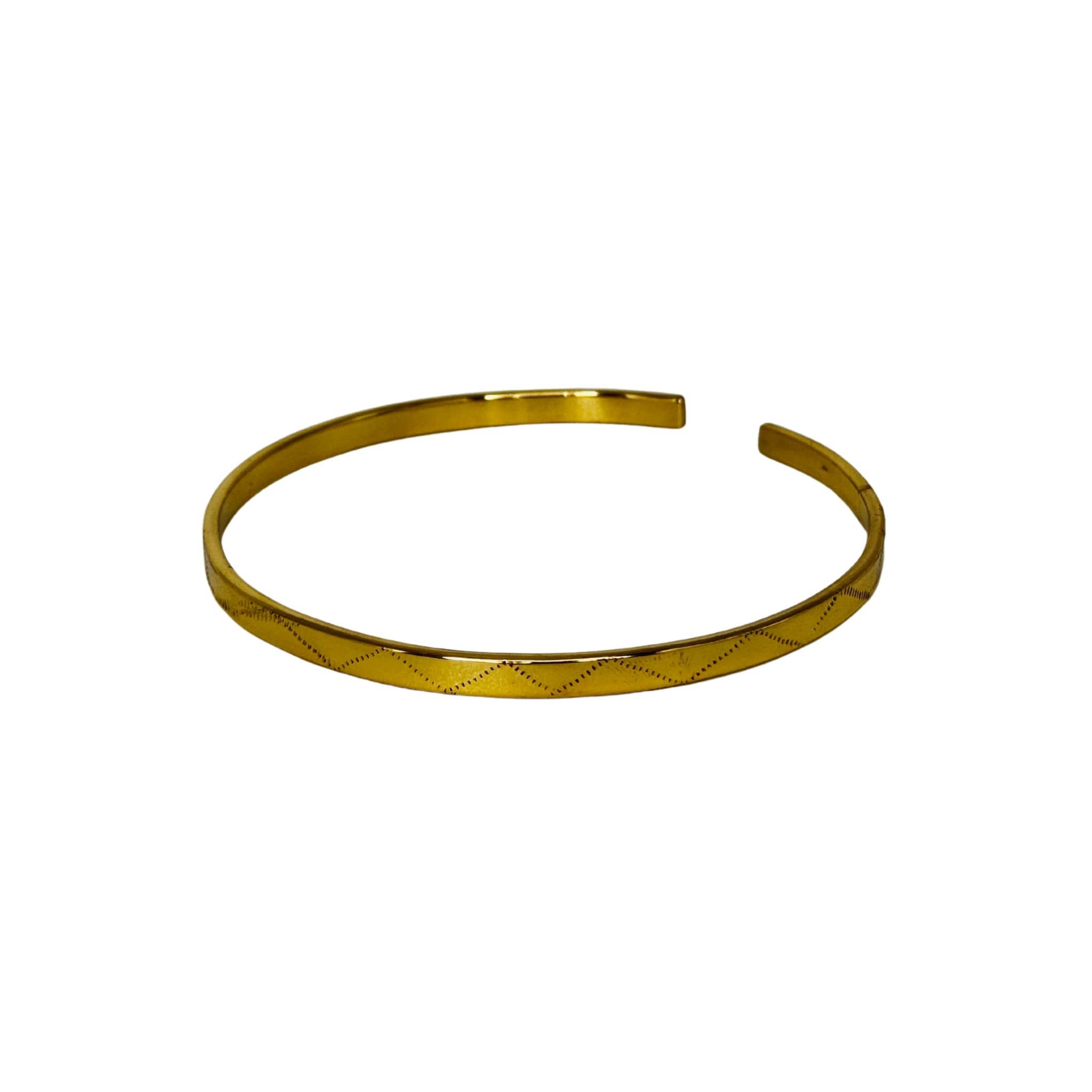 Rubi engraved zigzag brass armlet flat lay — Ecodunia