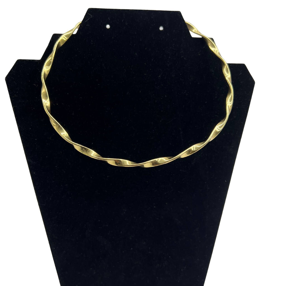 Sema twisted brass choker necklace on neutral surface flat lay — Ecodunia