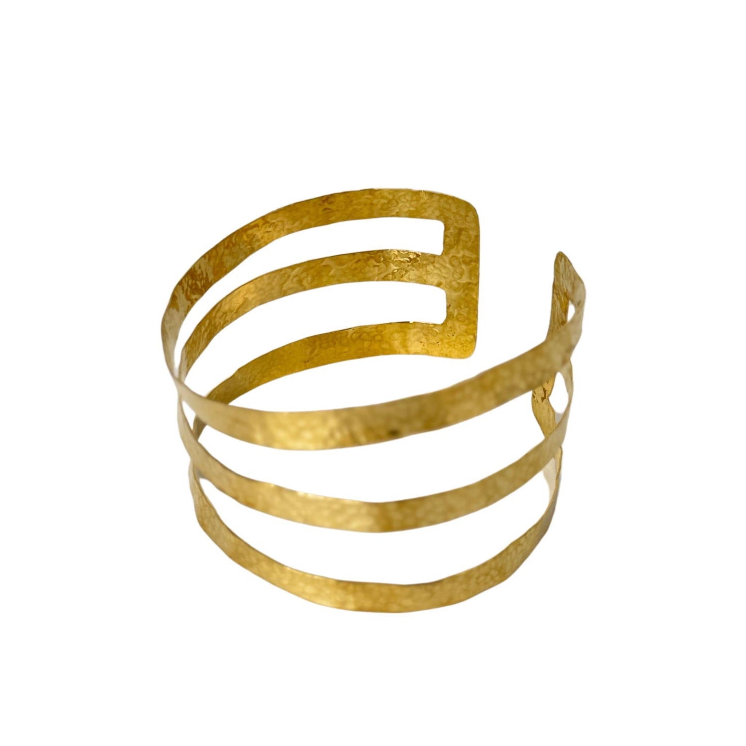 Siti three-band hammered brass armlet wide cuff flat lay — Ecodunia