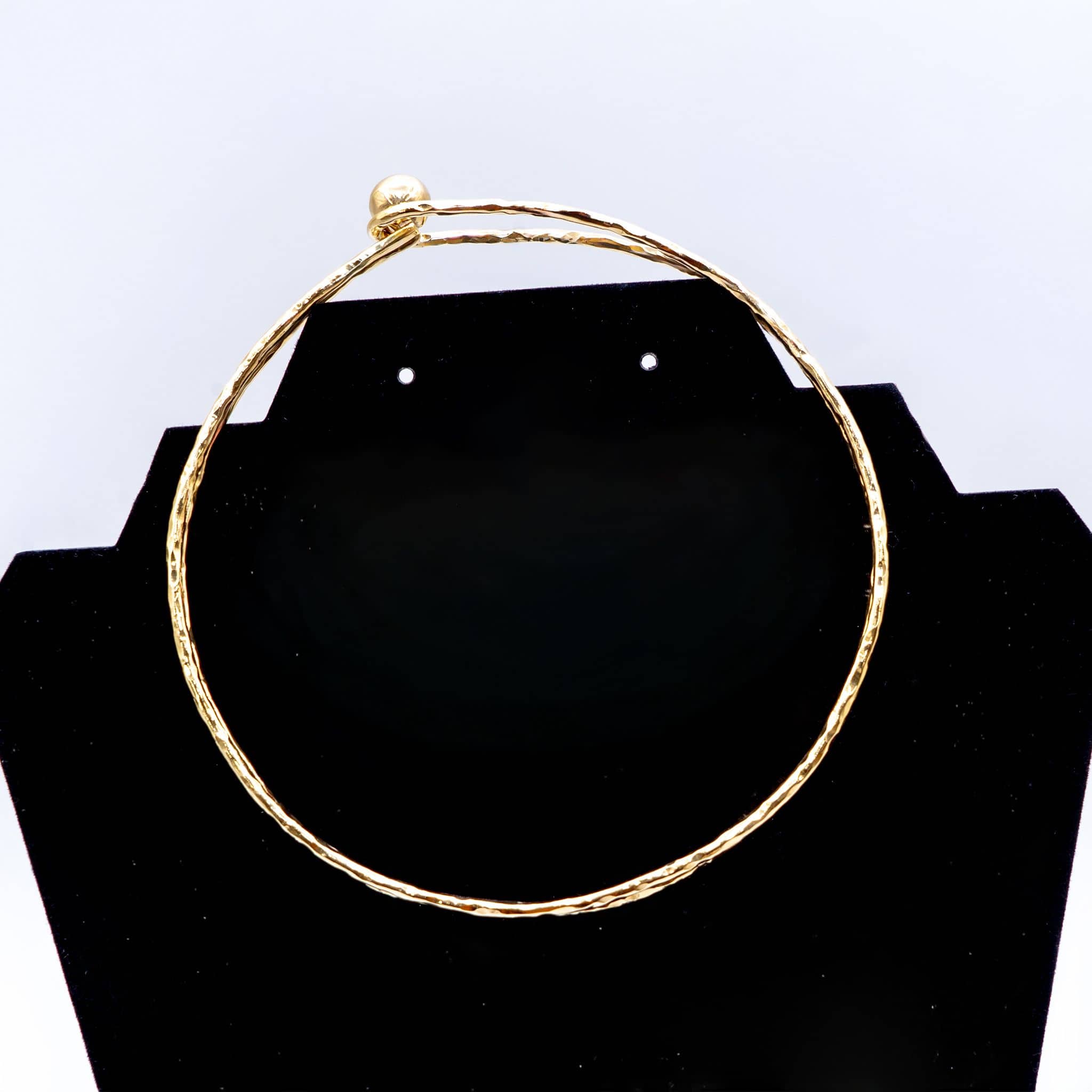 Sola sphere ball brass choker necklace flat lay on warm surface — Ecodunia