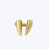 Kiota sculptural brass ring worn on hand showing swept blade forms