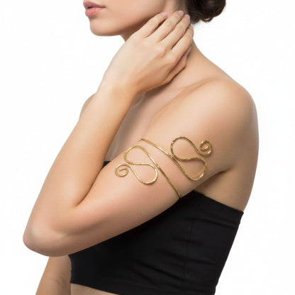 Tala hammered spiral brass armlet flat lay — Ecodunia