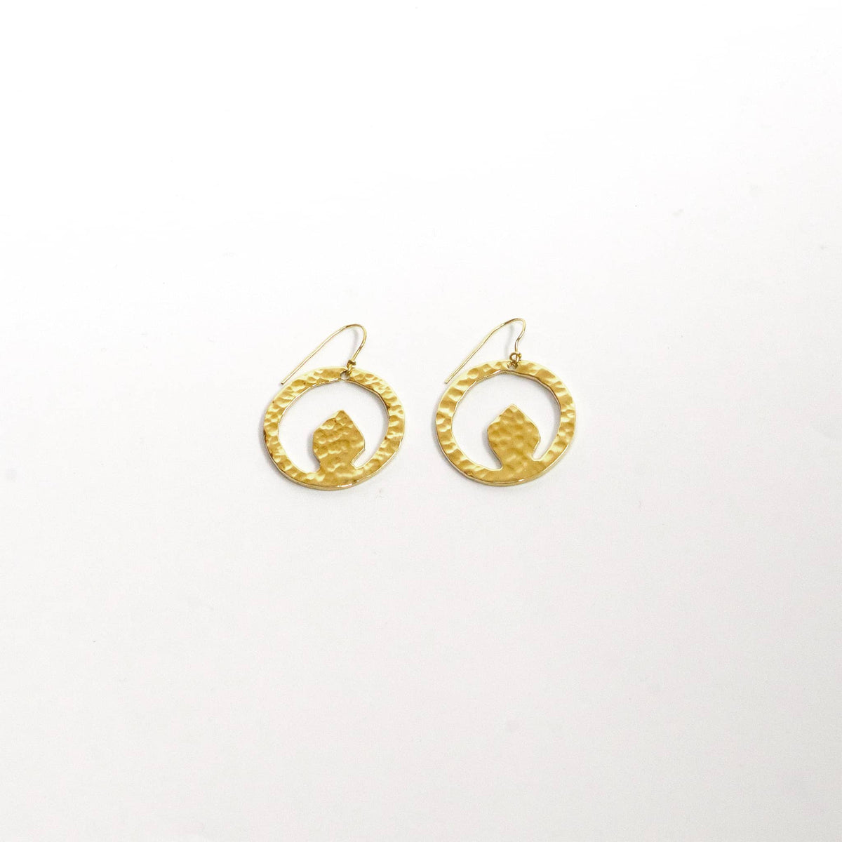 Tembo hammered brass disc earrings worn showing organic shape