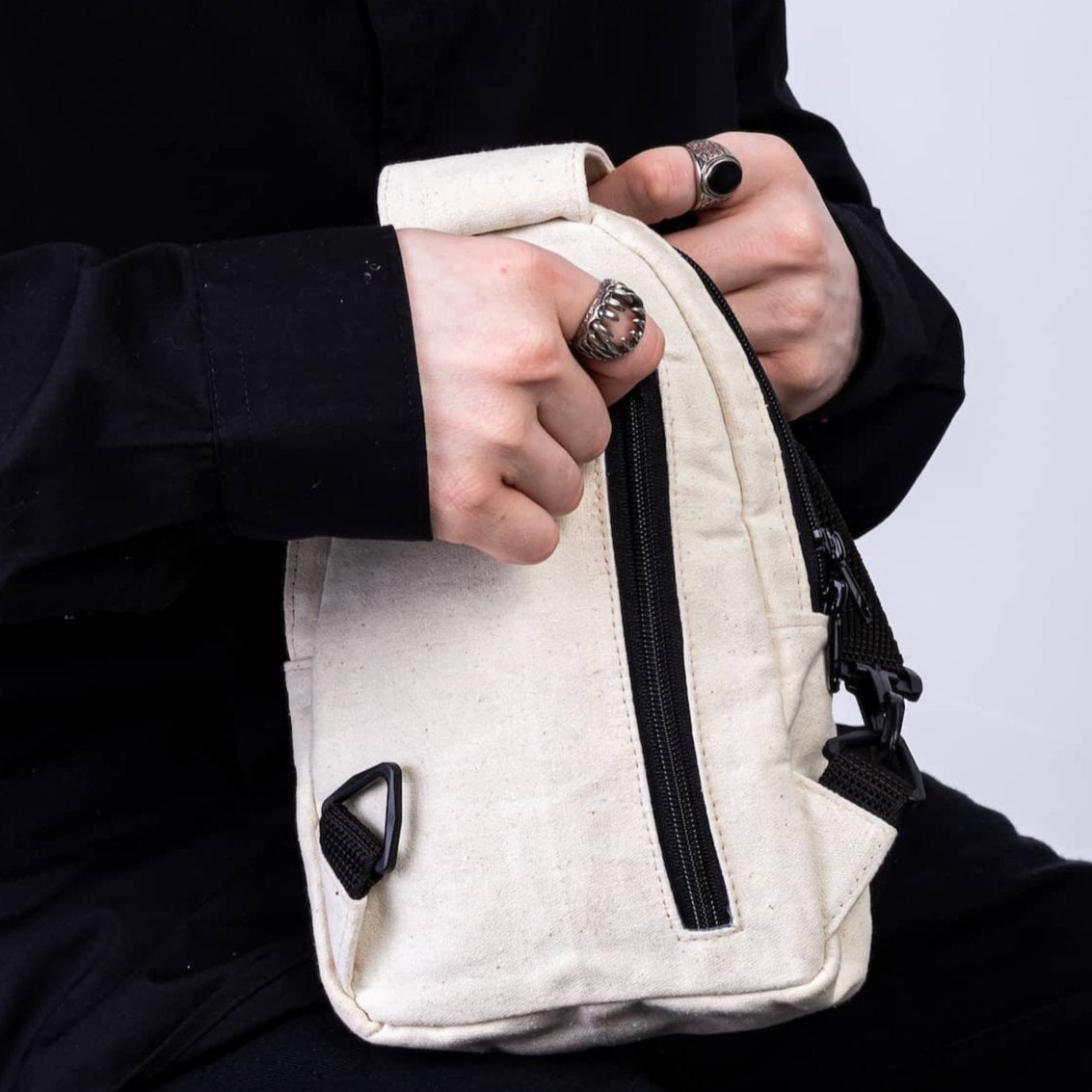 Buru natural canvas sling bag worn crossbody #color_natural