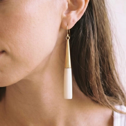 Lulu brass and white horn drop earrings flat lay — Ecodunia 