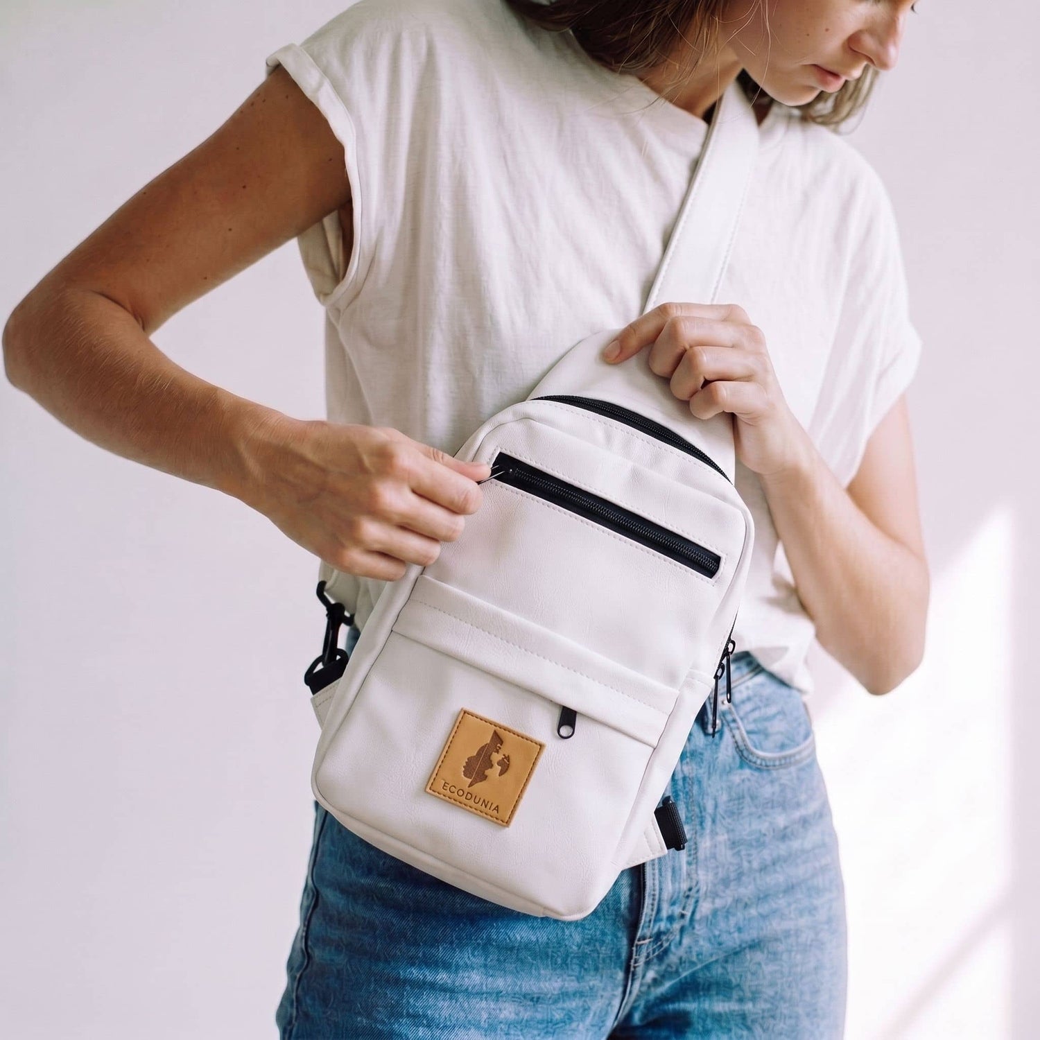 Umoja white vegan leather large sling bag travel 