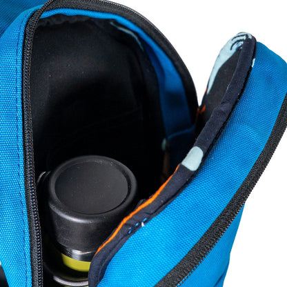Umoja canvas sling bag in Zilly Blue worn crossbody 