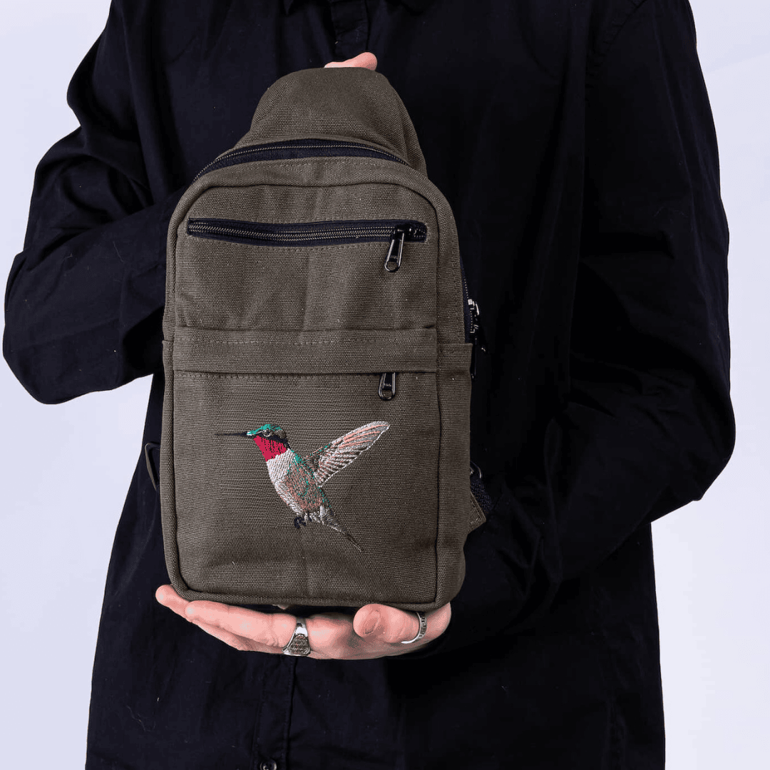 Umoja hummingbird embroidered canvas sling bag in green 