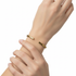 White model wearing Dona Wide Open Cuff Twist Bracelet